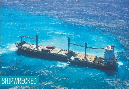  ?? Picture: AFP ?? The 184-m container ship that ran aground on July 12 on a reef has broken in two due to the swell. The nine crew members still on board were evacuated by rescue services yesterday.