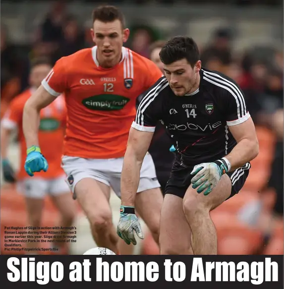  ??  ?? Pat Hughes of Sligo in action with Armagh’s Ronan Lappin during their Allianz Division 3 game earlier this year. Sligo drew Armagh in Markievicz Park in the next round of the Qualifiers.
Pic: Philip Fitzpatric­k/Sportsfile