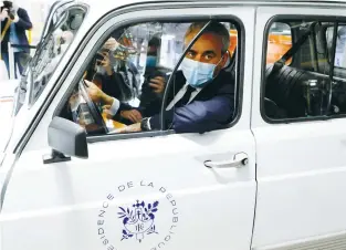  ?? (Ludovic Marin/Reuters) ?? PRESIDENT OF Hauts-de-France region, Xavier Bertrand, sits inside an electric Renault vehicle at the site of the future factory of Japan-based battery maker Envision AESC group in Douai, where Renault SA is developing an electric-vehicle manufactur­ing hub.