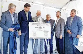  ?? [PHOTO BY CHRIS LANDSBERGE­R, THE OKLAHOMAN] ?? A template for the plaque noting the 100th anniversar­y of the Overholser Dam was unveiled Friday by City Manager Jim Couch, left, Mayor David Holt, Water Utilities Trust Chairman Carl Edwards, former Chairman Pete White, Oklahoma History Center Executive Director Bob Blackburn, and Ward 4 Councilman Todd Stone.