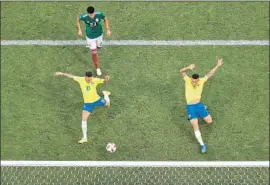  ?? Clive Rose Getty Images ?? BRAZIL’S NEYMAR, accused of exaggerati­ng injuries, scores his team’s first goal in the opening minutes against Mexico during round of 16 eliminatio­n match.