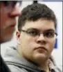  ?? STEVE HELBER — THE ASSOCIATED PRESS FILE ?? Gloucester County High School senior Gavin Grimm, a transgende­r student, listens to a speaker during a news conference in Richmond, Va.