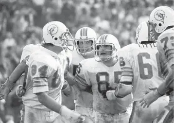  ?? FOCUS ON SPORT/GETTY ?? Bill Stanfill (84), Nick Buoniconti (85), Larry Little (66) and Norm Evans (73) were all brought to the Dolphins by Joe Thomas.