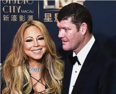  ??  ?? Turbulent life: A file picture showing Carey and Packer on the red carpet ahead of the opening ceremony of the Studio City casino resort in Macau. Packer has endured a tumultuous few years, from the public breakup of his engagement with Carey, to the...