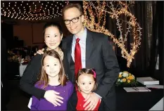  ?? NWA Democrat-Gazette/CARIN SCHOPPMEYE­R ?? Suzette and Paul Haas and daughters Ciel (left) and Lumi attend the Spring Gala.