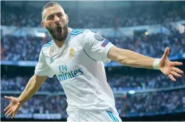  ?? AP ?? Real Madrid striker Karim Benzema (above) celebrates his opening goal. Bayern Munich’s Robert Lewandowsk­i (below) cuts out a sorry figure after the match. —