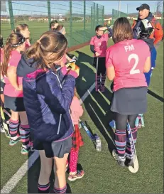  ??  ?? Coach Phil Adams inspires the team with a rousing half-time team talk.