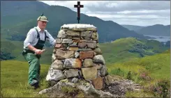  ?? Picture: Iain Thornber ?? Jimmy MacDonald putting the finishing touches to the cairn.