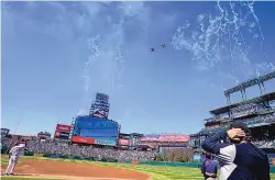  ?? DAVID ZALUBOWSKI/ASSOCIATED PRESS ?? Two F-16 jets from Buckley Air Force Base in Aurora, Colo., fly over Coors Field on opening day. Major League Baseball plans to relocate the All-Star Game to Coors Field in Denver.