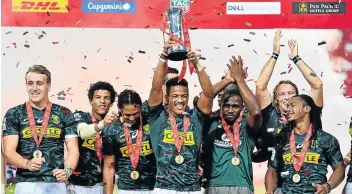  ?? Picture: THANANUWAT SRIRASANT/GETTY IMAGES ?? THAT WINNING FEELING: The SA Sevens rugby team celebrate after defeating Fiji in the final of the HSBC Sevens Singapore Cup final at the National Stadium last weekend.