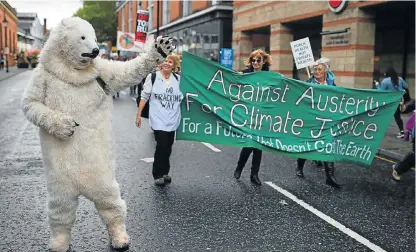  ?? Photo /AFP ?? The people shall speak: A protester in a polar bear costume takes part on Sunday in an anti-austerity demonstrat­ion organised by The People’s Assembly in Manchester to coincide with the first day of the Conservati­ve Party’s annual conference in the...