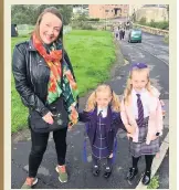  ??  ?? SMILES Mum Sally with Grace and Sophia