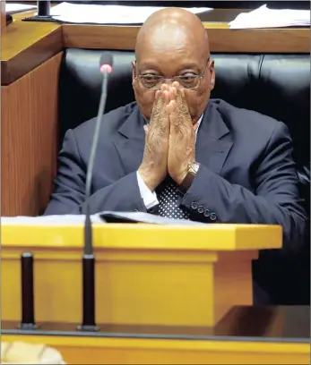  ?? PICTURE: REUTERS ?? President Jacob Zuma looks on as members of Julius Malema’s EFF party raise objections during Zuma’s question and answer session in Parliament yesterday.