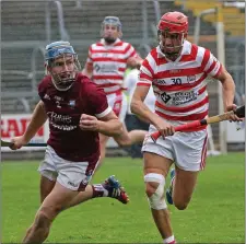  ??  ?? Conor Firman of St. Martin’s out-paces county colleague Paul Morris.