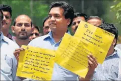  ?? MOHD ZAKIR/HT PHOTO ?? Sacked Delhi water minister Kapil Mishra shows copies of complaints filed against chief minister Arvind Kejriwal and other AAP leaders on Tuesday.