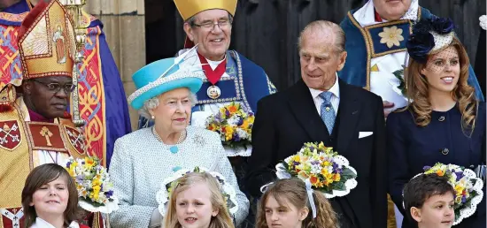  ?? ?? Revelation: Dr John Sentamu with the Queen, her ‘strength and stay’ Prince Philip and Princess Beatrice in 2012