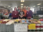  ?? ALIAH KIMBRO — THE MORNING JOURNAL ?? The Sassy Sewers, who meet at the Lorain Senior Center each week, showcase crafts and items during annual craft show.