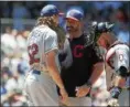  ?? RICK OSENTOSKI — ASSOCIATED PRESS ?? Mickey Callaway, center talks to starting pitcher Mike Clevinger and catcher Yan Gomes on July 2 in Detroit.