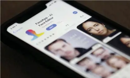  ??  ?? FaceApp users can upload a photo and apply a filter to show what they could look like when older or younger. Photograph: Jenny Kane/AP