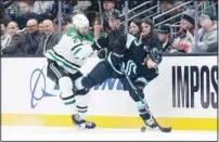  ?? ?? Seattle Kraken forward Jaden Schwartz (right), battles Dallas Stars defenseman Jani Hakanpaa for the puck during the third period of an NHL hockey game in Seattle. The Stars won 5-2. (AP)