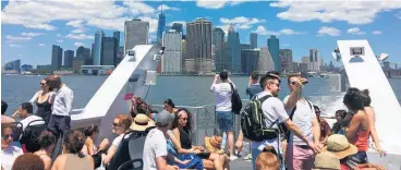  ?? Picture / Bloomberg ?? Travellers view Manhattan from a New York ferry.