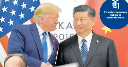  ?? Photo / AP ?? Paul Gruenwald (left) says the trade war between Donald Trump’s US and Xi Jinping’s China is the “number one risk” to the global outlook.