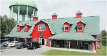  ?? JULIE OLIVER/OTTAWA CITIZEN ?? Next to the Stittsvill­e water tower, Gendron’s massive 10,000-square-foot red barn is a local landmark.