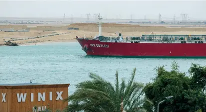  ?? Bloomberg ?? The SKS Doyles crude oil tanker moves along the Suez Canal towards Ismailia in Suez, Egypt, Dec. 21.