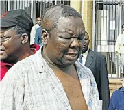  ?? Picture: AFP ?? The late Zimbabwe opposition leader Morgan Tsvangirai seen here leaving court in Harare after he was arrested and severely beaten by police in 2007.