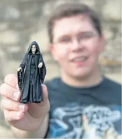  ?? Picture: Paul Smith. ?? Hunor Deak with a model of Star Wars character Emperor Palpatine, played by Ian McDiarmid.