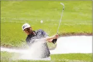  ?? Emil Lippe / Associated Press ?? Sebastian Munoz hits a shot out of a bunker on the sixth hole during the third round of the AT&T Byron Nelson in McKinney, Texas, on Saturday. Munoz sank the shot for eagle.