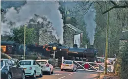  ?? ROBERT BATTY ?? With light falling on its last day in service, Midland 4F No. 43924 heads a Keighley & Worth Valley Railway Mince Pie Special over Oakworth level crossing on December 31.