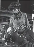  ??  ?? Dorothy Walker, a welding instructor at Milwaukee Area Technical College, supervises the work of a class of women in 1978.