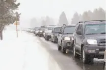  ?? Marcin Wichary / Flickr ?? Top and above: Traffic crawling into South Lake Tahoe can take some of the fun out of a ski trip. Officials are working to find solutions such as better bus shuttles to ski resorts.