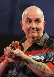  ?? Foto: dpa ?? Der erfolgreic­hste Darts Spieler der Ge schichte: Phil Taylor.