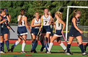  ?? BILL RUDICK — FOR DIGITAL FIRST MEDIA ?? Unionville players congratula­te Madison Miles (7) after the game’s only goal Friday.