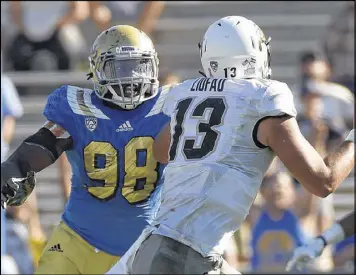  ?? LISA BLUMENFELD / GETTY IMAGES ?? UCLA’s Takkarist McKinley is the kind of aggressive pass rusher the Falcons hope will complement the efforts of Vic Beasley and his comrades.