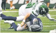  ?? USA TODAY Sports; Bill Kostroun ?? IN A RUSH: New talent and an aggressive scheme has John Franklin-Myers, sacking Titans QB Ryan Tannehill last season (above) and speaking Wednesday (top right), and the Jets thinking the defensive line can cause problems for opponents.