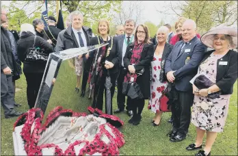  ?? ?? STEEL SCULPTURE The Sheffield delegation at the National Memorial Arboretum