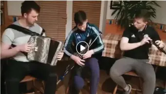  ??  ?? Diarmuid, Éamon and Colm Ó Meachair play some tunes to raise our spirits