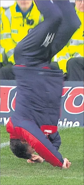  ??  ?? HEAD OVER HEELS: Graeme Murty’s bizarre handstand flip at Dens Park