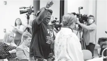  ?? BOB SELF/ THE FLORIDA TIMES-UNION ?? Ben Frazier, the founder of the Northside Coalition of Jacksonvil­le, chants “Allow teachers to teach the truth” before the Florida State board of Education during public comments this month on the state’s plan to ban the teaching of critical race theory in state public schools. Many in the audience joined in.