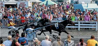  ?? PHOTO: JOSEPH JOHNSON/FAIRFAX NZ ?? Arden Rooney wins the first of his two Kaikoura Cups in front of a large crowd at South Bay Racecourse.