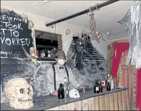  ?? Callie Jones / Sterling Journal-advocate ?? A spooky bar tender waits to serve guests inside Sterling Miracle Players' "Pandemic 2020" haunted house.