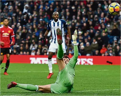  ?? — AFP ?? Horror show: West Bromwich Albion goalkeeper Ben Foster fails to stop a deflected shot by Manchester United’s Jesse Lingard in the English Premier League match at The Hawthorns on Sunday. United won 2-1.