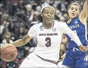  ?? SEAN RAYFORD / ASSOCIATED PRESS ?? South Carolina guard Kaela Davis, a Georgia Tech transfer, dribbles past UNC Asheville’s Ali Trani. Davis had six points and nine rebounds.