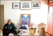  ?? Former scrumhalf Norman Mbiko with some of his historical photos. ??