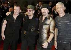  ?? ANDREW MEDICHINI — AP FILE ?? Members of the Irish band U2, from left, Larry Mullen Jr., Bono, The Edge and Adam Clayton appear at the screening of “U2 3D,” at the internatio­nal film festival in Cannes, southern France, in 2007.