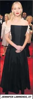  ??  ?? JENNIFER LAWRENCE, 27 The Red Sparrow star looked striking in a black strapless Dior gown with angular front and sheer sleeves.