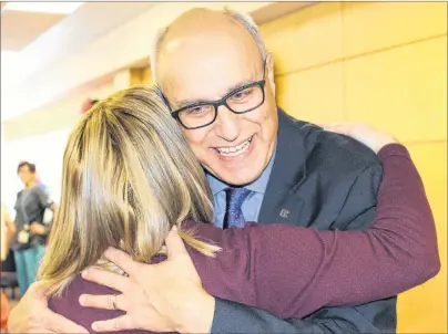  ?? MILLICENT MCKAY/JOURNAL PIONEER ?? Dr. Wassim Salamoun receives a congratula­tory hug from PCH staffer Stacy MacDonald. On Tuesday, Salamoun was named the 2017 recipient of the Dr. Tom Moore Award.